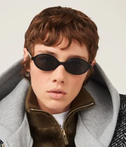 Miu Miu Oval Sunglasses In Black